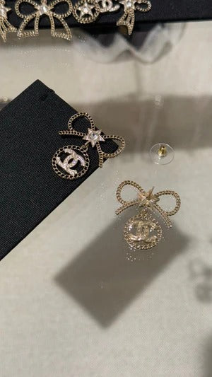 Chanel Black Letter Earrings With White Ribbon And Bow