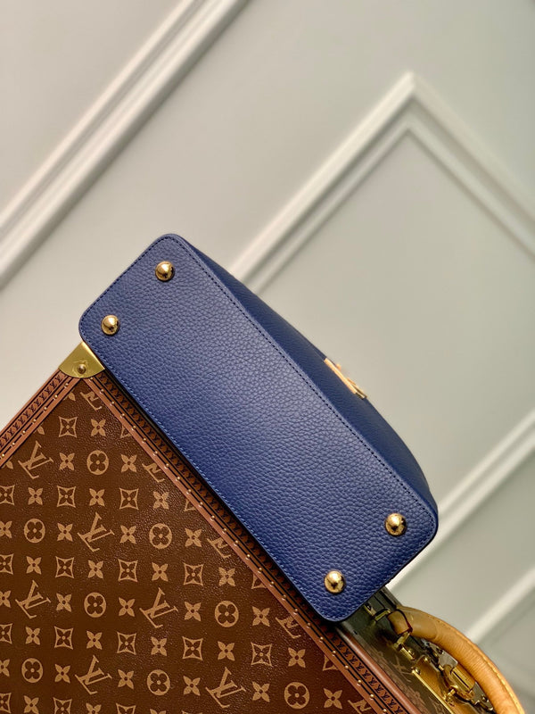 capucines mm 31.5 dark blue taurillon leather gold hardware