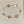 STAR AND SUN 5 MOTIF MOP PINK GOLD BRACELET