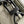 TRIO MESSENGER 25 IN GRAY MONOGRAM SHADOW CALFSKIN