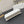 CARO SLIM POUCH 21 BAG IN WHITE CALFSKIN