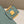 BAGUETTE WITH FF MOTIF 27 IN VIRIDIAN GREEN SOFT LAMBSKIN GOLD HARDWARE
