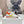 FLOW RUNNER SNEAKER IN PALE GRAY MIX VIVID ORANGE SUEDE AND SHEEPSKIN