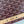 MONTE-CARLO PM CLUTCH 25 IN WINE RED GOYARDINE CANVAS