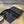 CASSETTE 23 IN BLACK CALFSKIN WITH WAVY PATTERN