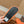 FURRY SLIDES IN ORANGE CURLY SHEARLING