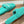FURRY SLIDES IN TURQUOISE CURLY SHEARLING
