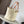 Medium anagram basket bag in iraca palm and calfskin