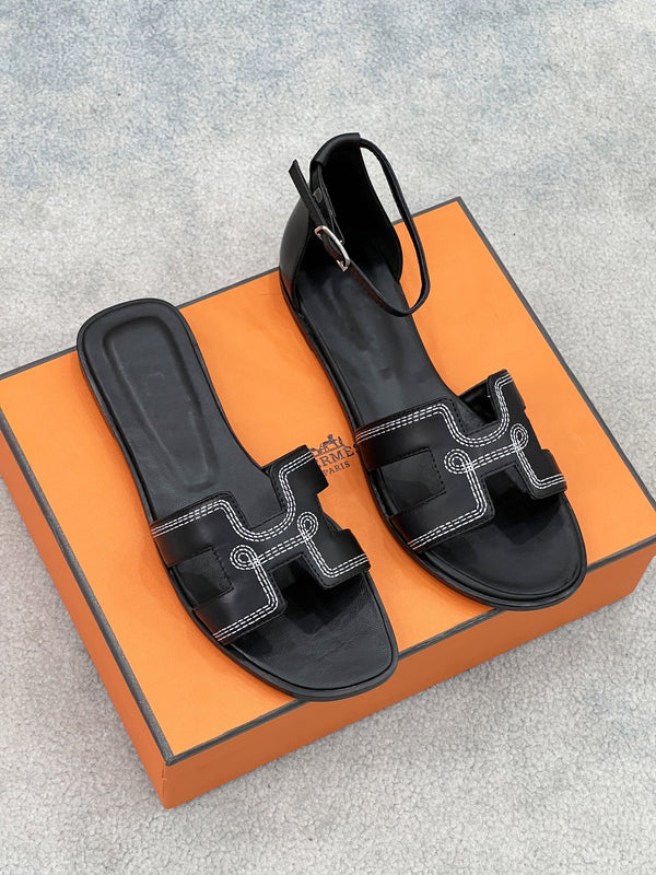 0ran sandal black white epsom