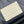 TRIO MESSENGER 25 IN CREAM BLUE MONOGRAM SHADOW CALFSKIN