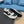 PRA SNEAKER IN WHITE CALFSKIN AND BLACK FABRIC WITH GOLDEN LOGO