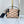 SIDE TRUNK 21 IN BEIGE RED LAMBSKIN WITH CRISS CROSS PATTERN GOLD HARDWARE