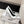 POINTED HIGH PUMPS IN WHITE PATENT CALFSKIN WITH CRYSTAL BUCKLE
