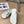 POOL GRAFFITI CROCS SLIDE SANDALS IN WHITE AND BLACK RUBBER