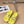 POOL GRAFFITI CROCS SLIDE SANDALS IN YELLOW AND BLACK RUBBER