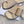 PETAL BELT FLAT SANDAL IN BEIGE CREAM CALFSKIN