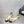 BEIGE MIX BLACK LAMBSKIN CAMELLIA HOLLOW SANDAL