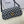 LOLA BAGUETTE BAG 28 IN BLACK MIX WHITE MONOGRAM CANVAS AND CALFSKIN