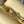 CAPUCINES EAST-WEST MINI 22 IN BANANA YELLOW TAURILLON GOLD HARDWARE