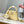 CAPUCINES EAST-WEST MINI 22 IN BANANA YELLOW TAURILLON GOLD HARDWARE