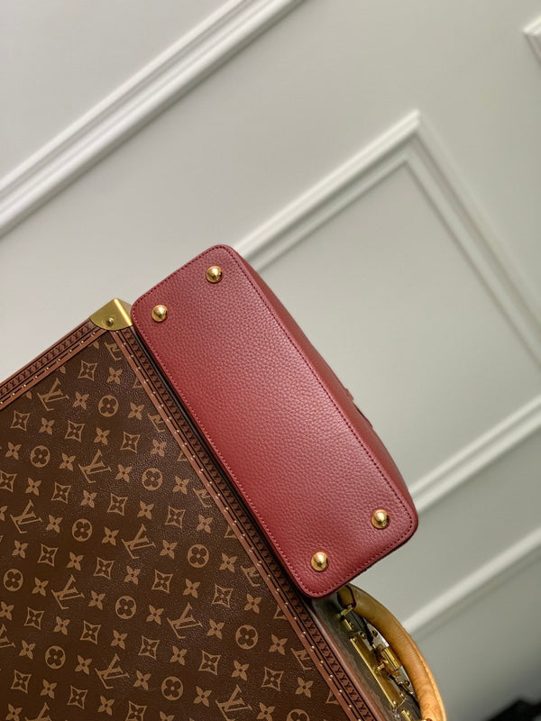 capucines mm 31.5 burgundy taurillon leather gold hardware