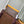 GASTON WEARABLE WALLET 18 IN BROWN MONOGRAM CANVAS MIX YELLOW CALFSKIN