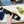 PRA SAFFIANO PATENT SLIDES OSTRICH MOTIF PEAR CALFSKIN