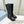 KNEE BOOTS WITH TRIANGLE LOGO IN BLACK CALFSKIN