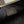 FENDIGRAPHY MEDIUM 29 IN WHITE AND ORANGE TRIM SMOOTH LAMBSKIN GOLD HARDWARE
