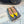 ALAIA FLAT SLINGBACK IN YELLOW PATENT CALFSKIN AND FILM