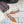 ALAIA FLAT SLINGBACK IN TIGER ORANGE PATENT CALFSKIN AND FILM