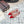 ALAIA FLAT SLINGBACK IN CHERRY RED PATENT CALFSKIN AND FILM