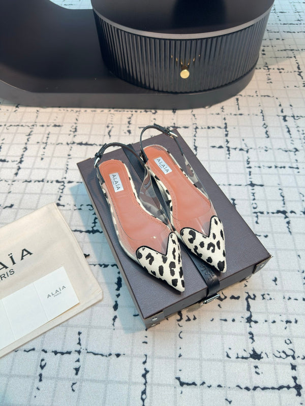 ALAIA FLAT SLINGBACK IN BLACK MIX WHITE PATENT CALFSKIN AND FILM