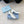 BALLERINA PUMPS WITH TRIANGLE LOGO AND BOW IN WHITE CALFSKIN