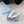 BALLERINA PUMPS WITH TRIANGLE LOGO AND BOW IN WHITE CALFSKIN