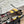 HERBAG ZIP 31 LAQUERED BAG IN BROWN MIX YELLOW H PLUME CANVAS