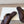 PETAL BELT FLAT SANDAL IN RUSSET BROWN CALFSKIN