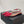 ALAIA LE COEUR FLAT SLINGBACKS IN CHERRY RED PATENT LAMBSKIN