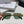 TRIOMPHE SUNGLASS 512997 IN GOLD METAL BLUE LENSES
