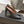 ALAIA SPIKE JEWEL MULES IN BLACK CALFSKIN