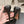 ALAIA SPIKE JEWEL MULES IN BLACK CALFSKIN