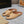 ALAIA FLAT MULE IN SEPIA TAN LAMBSKIN