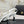 CHAIN BOW HIGH HEEL 8 CM SLINGBACKS IN WHITE SUEDE