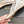 ALAIA FLAT MULES IN WHITE MESH FISHNET