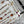 LV 25 Decorative Pattern Gemstone Chain Pleated Skirt White Poliester