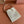 WANDER BUCKET BAG 23 WHITE IN RAFFIA WITH LEATHER TRIM